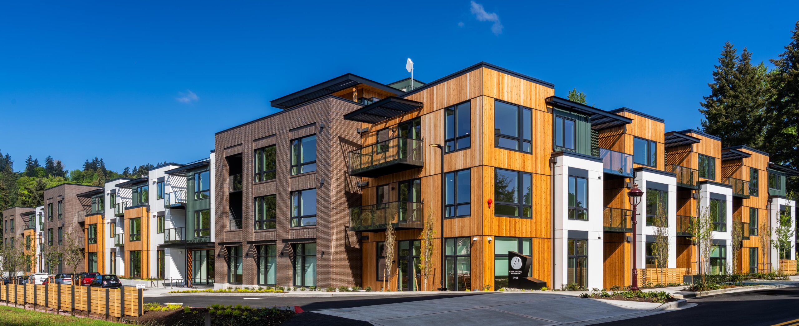 The residences at Parkshore Juanita Bay on a bright sunny day